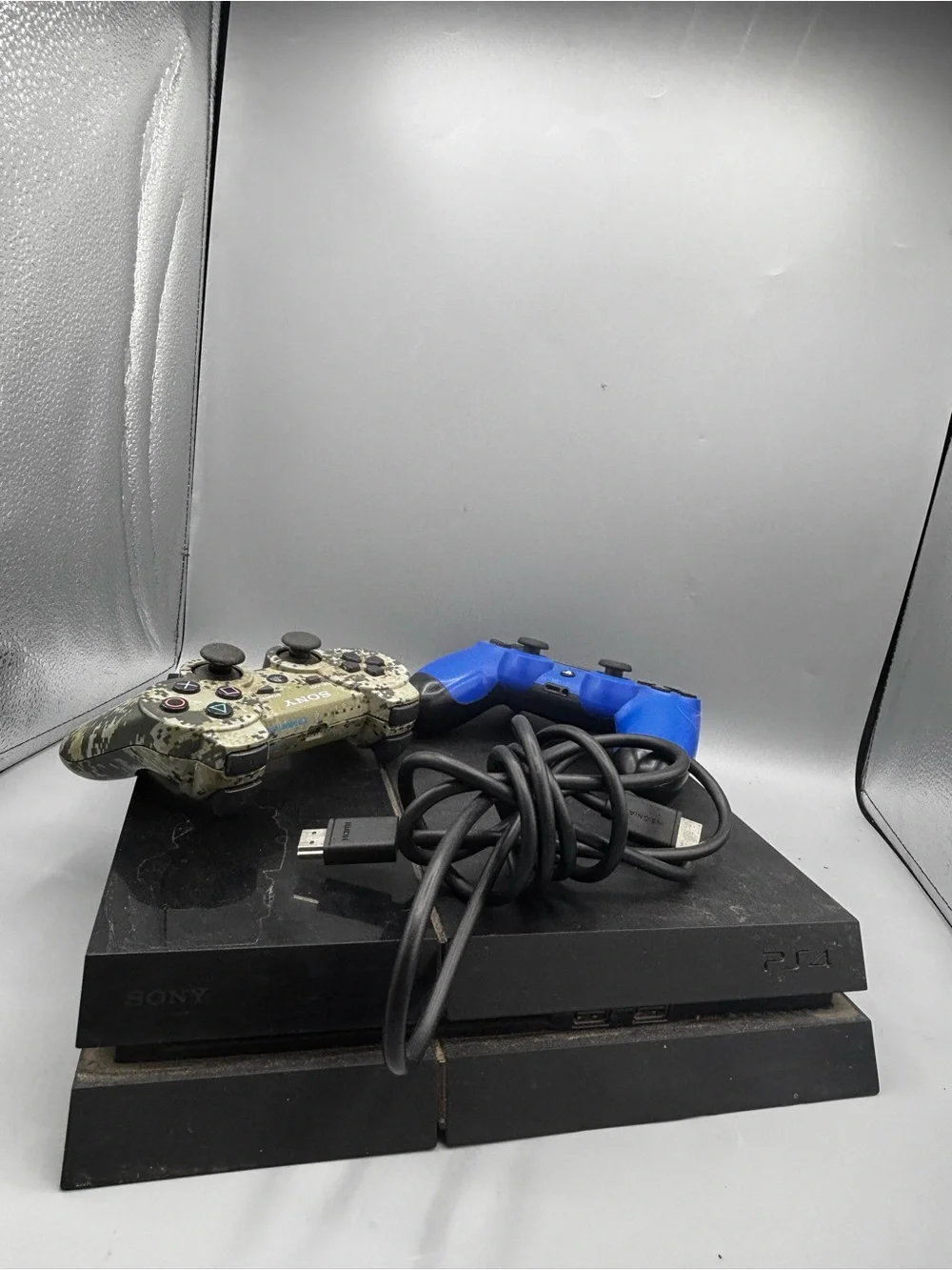 Sony PS4 Slim with Blue and Camouflage DualShock Controllers